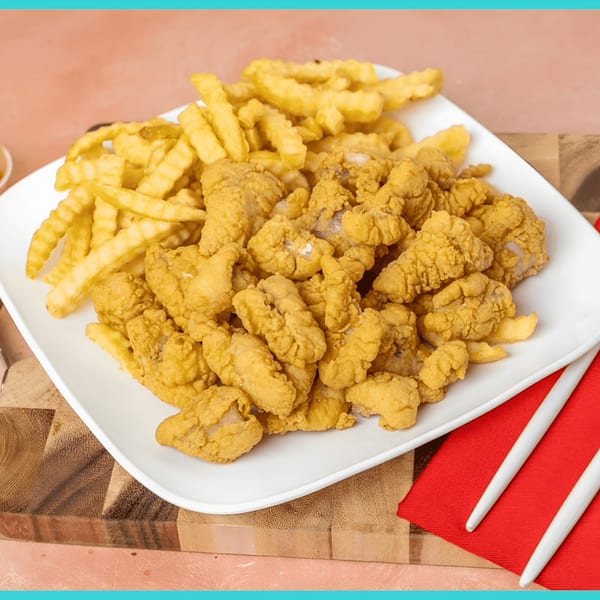 A white plate filled with golden-brown fried clam strips and crinkle-cut french fries.