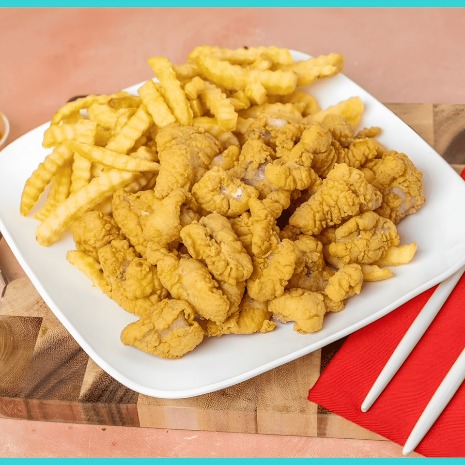 A white plate filled with golden-brown fried clam strips and crinkle-cut french fries.